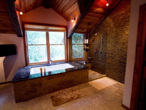 Incredible rustic bathroom with large tub